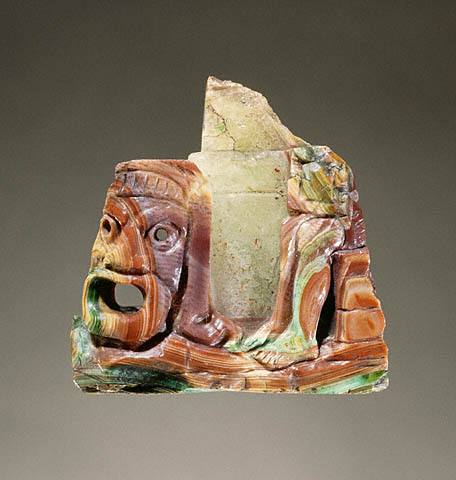 a large pierced mouth form part a large pierced mouth form part
