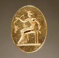 Ring with a Woman Weighing Eros Figures / Greek