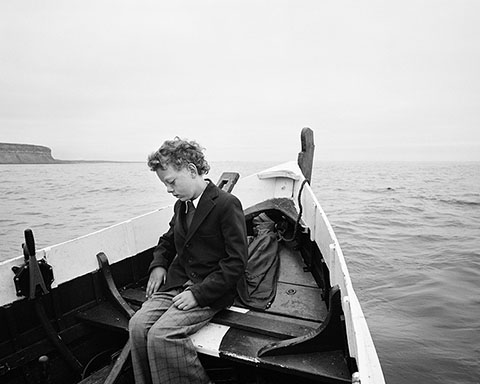 Simon Being Taken out to Sea for the First Time since His Father Drowned, Skinningrove, North Yorkshire, negative 1983; print 2014, Chris Killilp, gelatin silver print. Courtesy of and © Chris Killip.