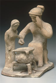 Statuette of a Woman Teaching a Girl to Cook