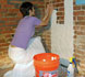 conservator applies a poultice