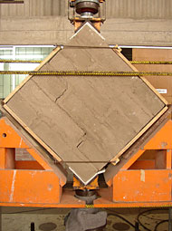 mud-brick wall showing grouting research