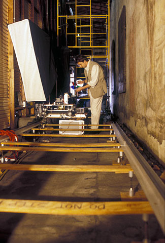 conservators working on mural