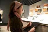A student works on an activity during a Guided Visit to the Getty Villa.