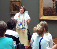 A curator talks to local teachers in the galleries.