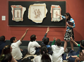 Students learn about ancient Roman frescoes during a school visit to the Getty Villa.