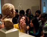 High-school students study Franz Xaver Messerschmidts Vexed Man at the Getty Center.