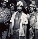 Photographs of workers, on view from November 3