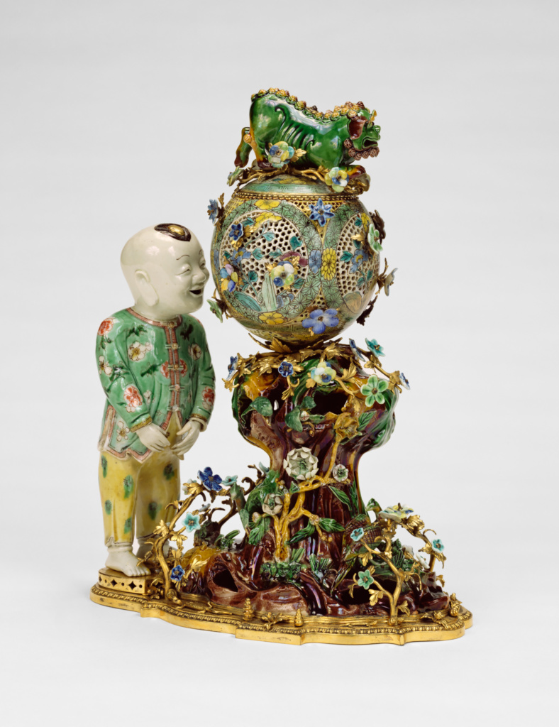 Pair of Decorative Groups; Porcelain maker Unknown maker, Chinese, Bronzier Unknown maker, French, Flowers made at the Chantilly Porcelain Manufactory (French, active about 1725 - about 1792); figures 1662 - 1722; spheres 1736-1795; flowers about 1740; Hard- and soft-paste porcelain, polychrome enamel decoration; gilt-bronze mounts; 78.DI.4 No description of this image is available.