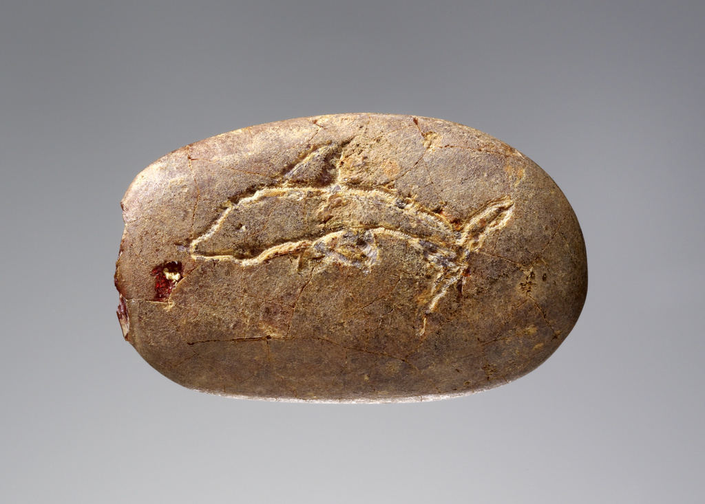 Pendant with Engraved Fish and Papyrus; Unknown; 700–600 B.C.; Amber; 82.AO.161.285; Rights Statement: No Copyright - United States Pendant with Engraved Fish and Papyrus; Unknown; 700–600 B.C.; Amber; 82.AO.161.285; Rights Statement: No Copyright - United States