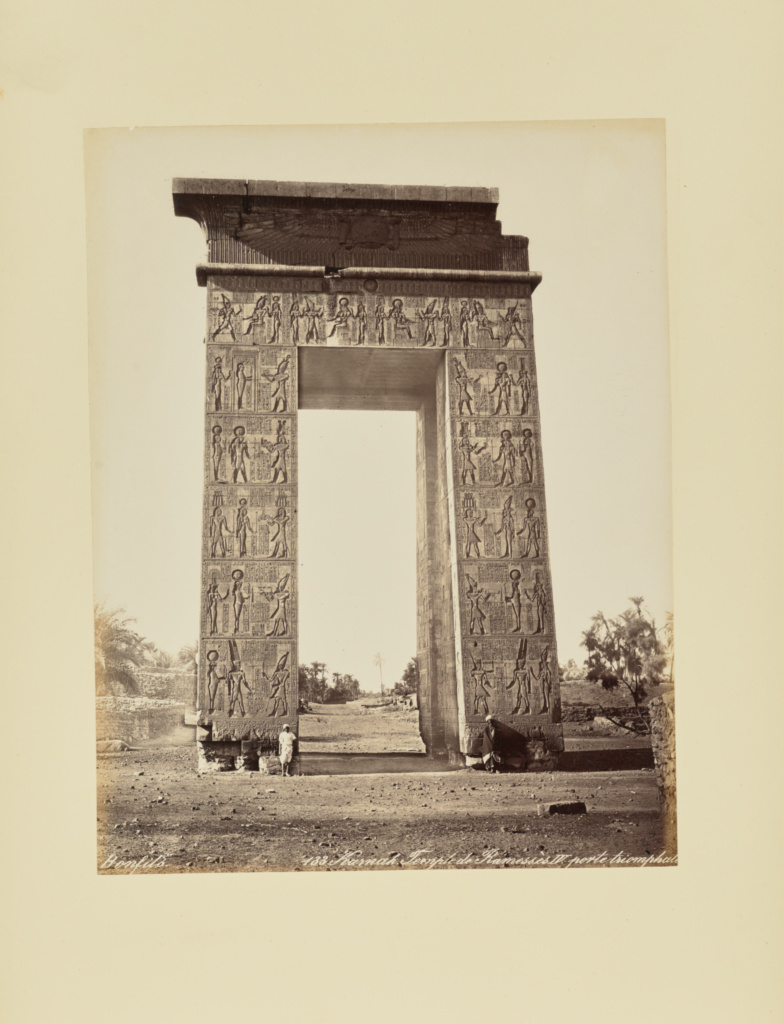 Karnak. Temple de Ramessès IV. Porte triomphale; Félix Bonfils (French, 1831 - 1885); 1870s; Albumen silver print; 27 × 21 cm (10 5/8 × 8 1/4 in.); 86.XA.750.36; Rights Statement: No Copyright - United States Karnak. Temple de Ramessès IV. Porte triomphale; Félix Bonfils (French, 1831 - 1885); 1870s; Albumen silver print; 27 × 21 cm (10 5/8 × 8 1/4 in.); 86.XA.750.36; Rights Statement: No Copyright - United States