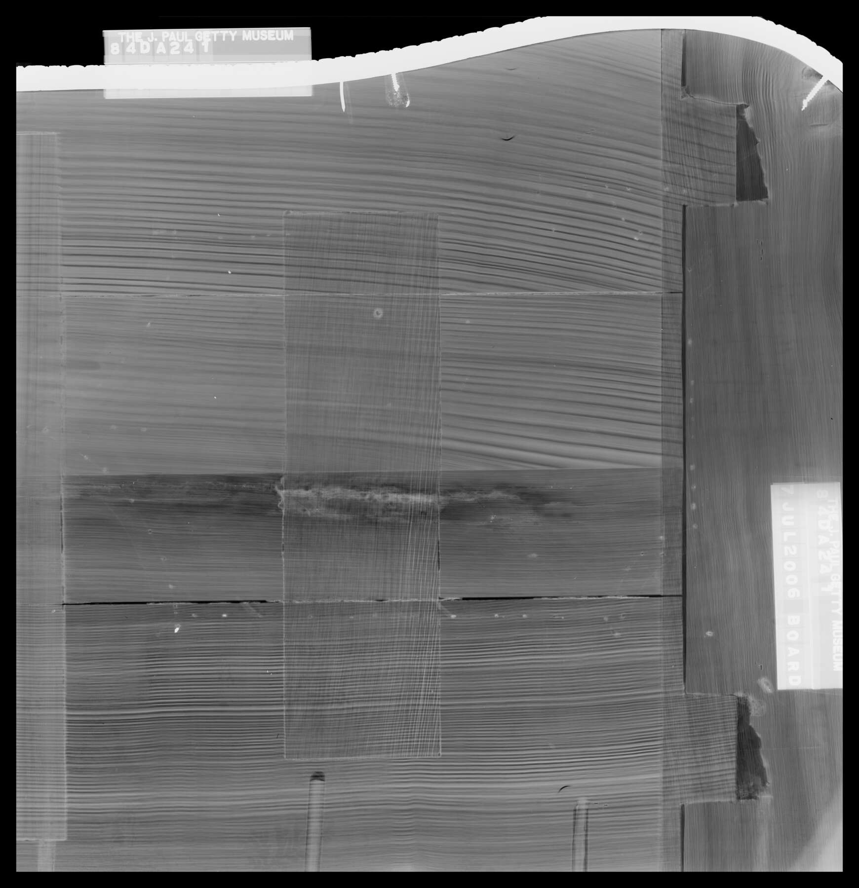 composite of two black and white x-rays of one of the cabinets, revealing the joinery of the sliding shelf located in between the two sets of cabinet doors