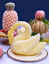 collage of food including a swan carved from butter