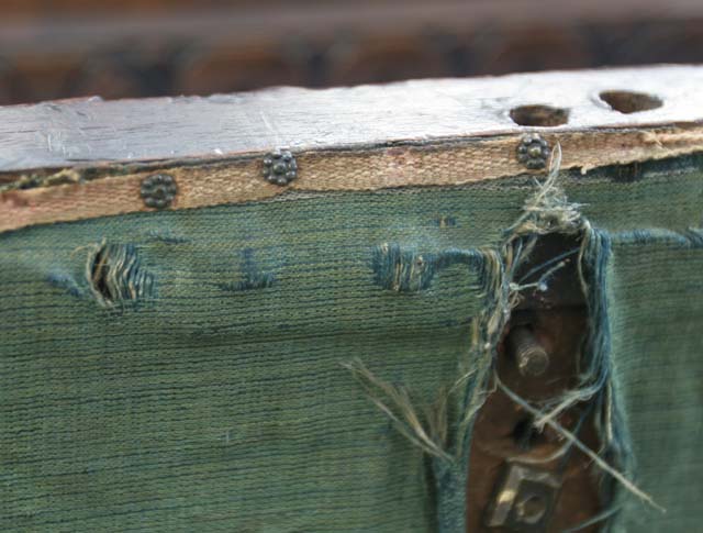 Loose threads in the cabinet's drawer lining