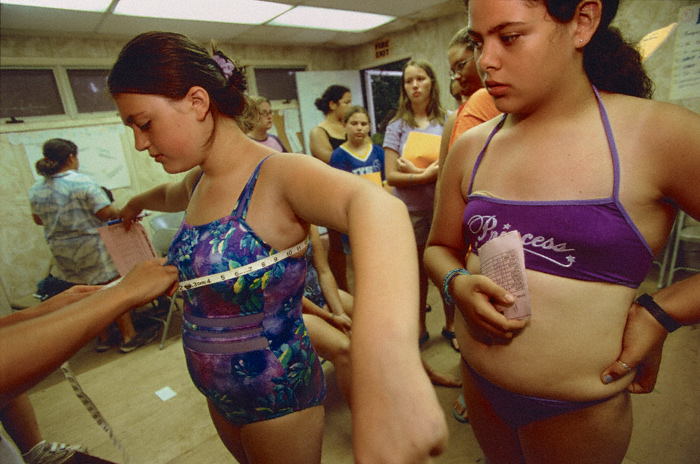 Danielle, 13, gets measured / Greenfield