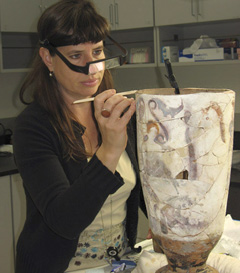 Conservator Marie Svoboda restoring a lekythos from Berlin