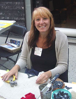 Lillian Sizemore demonstrates mosaic-making at the Getty Villa