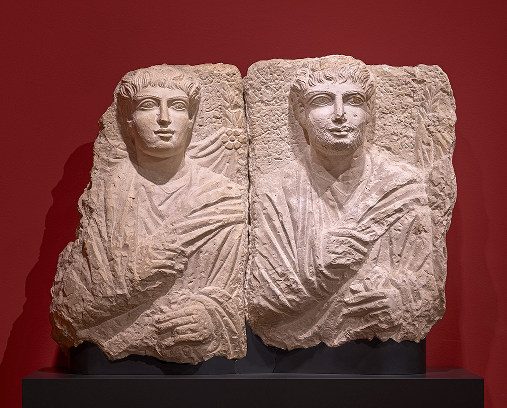 Male and His Sons(?), AD 190–210, limestone. Cantor Arts Center at Stanford University, Stanford Family Collection, Palo Alto JLS.17200 (left) and Ny Carlsberg Glyptotek, Copenhagen IN 2775