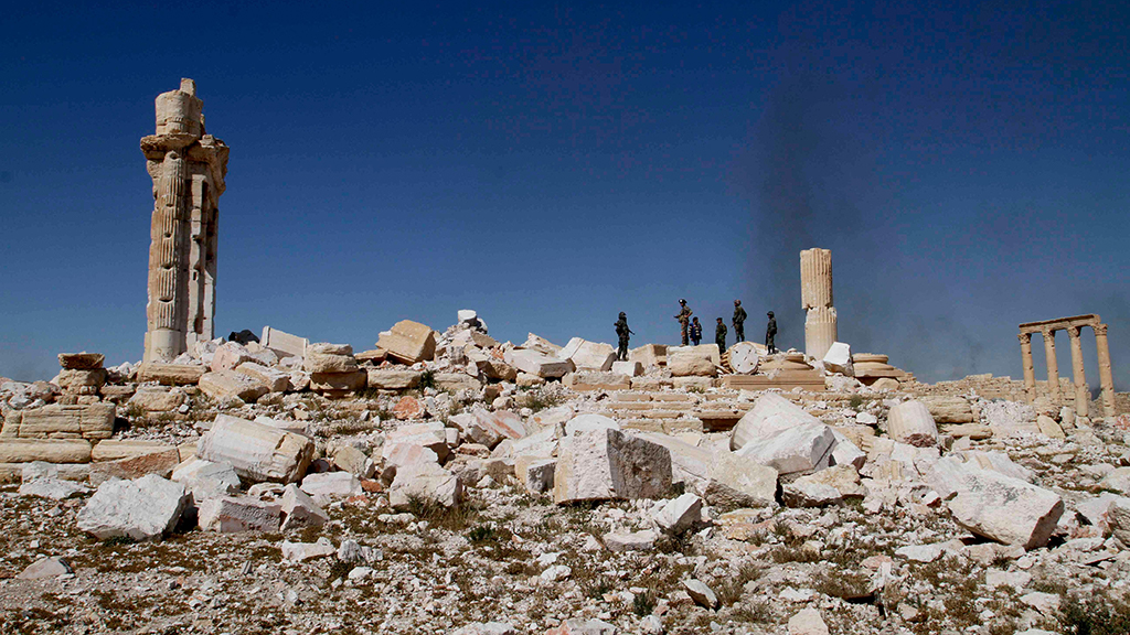 Syrian soldiers standing among the ruins of the Temple of Bel, April 1, 2016. Image © Yang Zhen/Xinhua/Alamy Live News