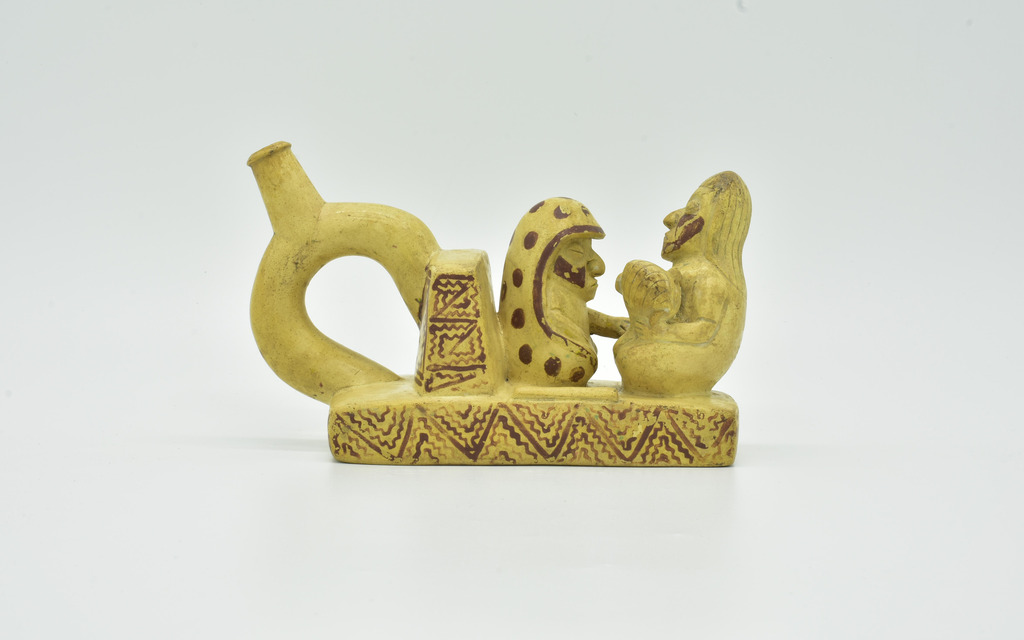Vessel with a Mother, a Baby, and a Curer, Moche, 300–450 CE. Terracotta. Complejo Arqueológico El Brujo-Museo Cao. Ministry of Culture, Peru. Image courtesy Ministerio de Cultura, Museo Nacional de Arqueología, Antropología e Historia del Perú, Lima / Museo Cao