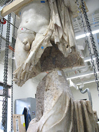 Statue of a god in the Antiquities Conservation studios at the Getty Villa showing its tenon-and-mortise construction