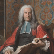 Portrait of white male in 1700s dress wearing a white, curled wig and red robes while he holds and open book