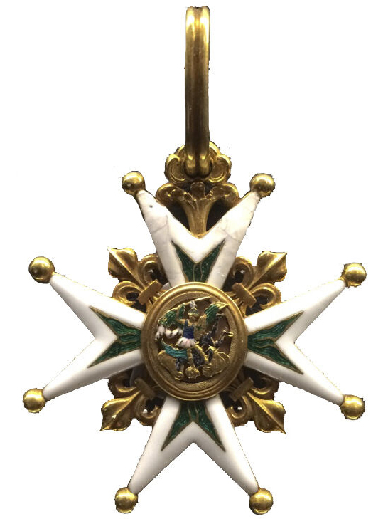 Badge consisting of a four-armed, double-pointed, ball tipped cross with white enameled rims. Fleurs-de-lis motifs in gold emerge from the angles of the cross arms. An oval medallion in the center features the figure of Saint Michael in a slaying act. The cross is suspended from a gold ring.