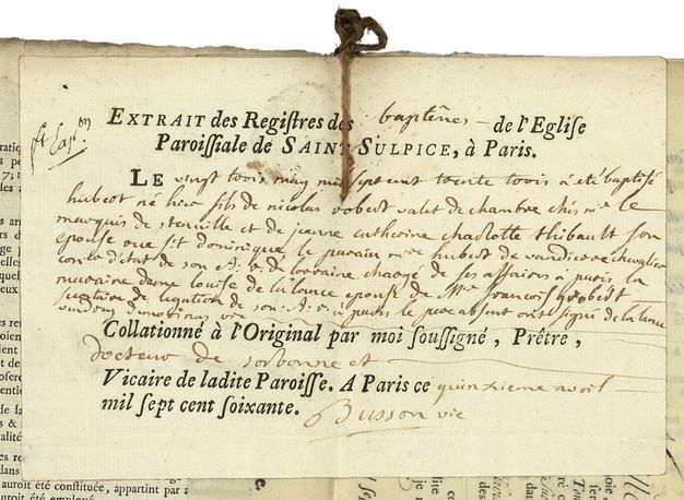 Cream-colored paper featuring typed and handwritten text in black regarding a baptism held at Saint-Sulpice Parish Church in Paris.