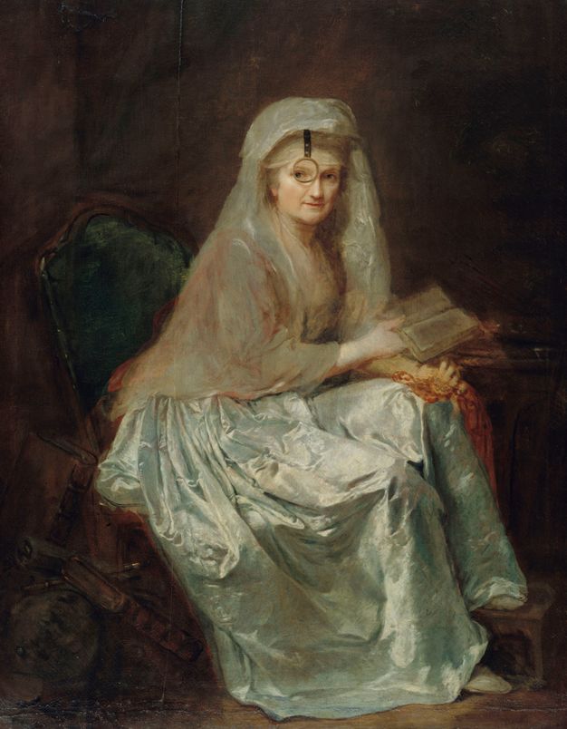 Portrait of a woman on a green armchair holding an open book on her right hand and a string of beads on her left. She wears a monocle that appears to be attached to her headdress from which it hangs in front of her face.