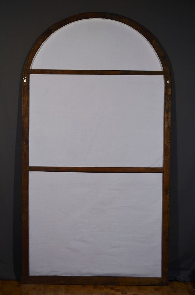 Photo of the relined back of the painting, now pale with new lining.