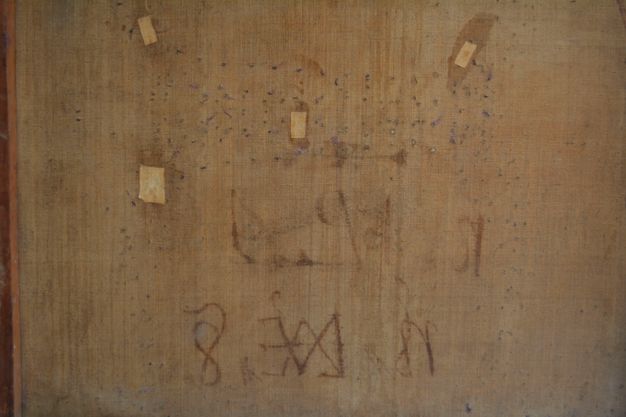Photo of the back of the painting (26.2) canvas that has vague marks.