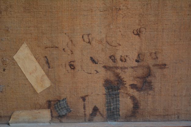 Close up photo of the canvas (26.2) back with visible marks.