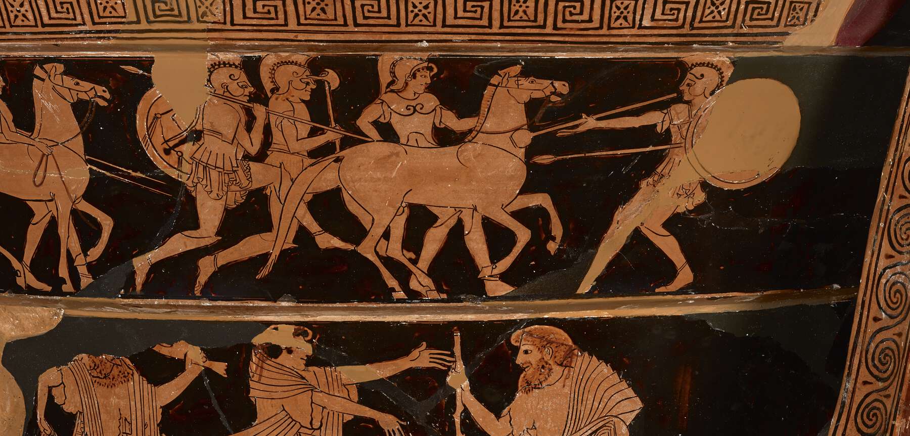 A detail of the neck, with people and horses chasing/attacking one person