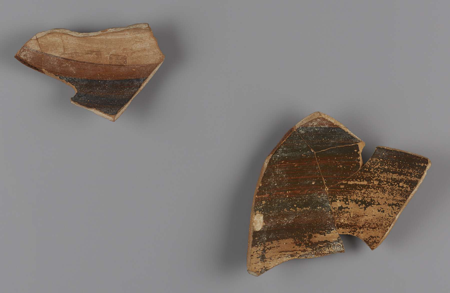 The back side of the two pottery fragments