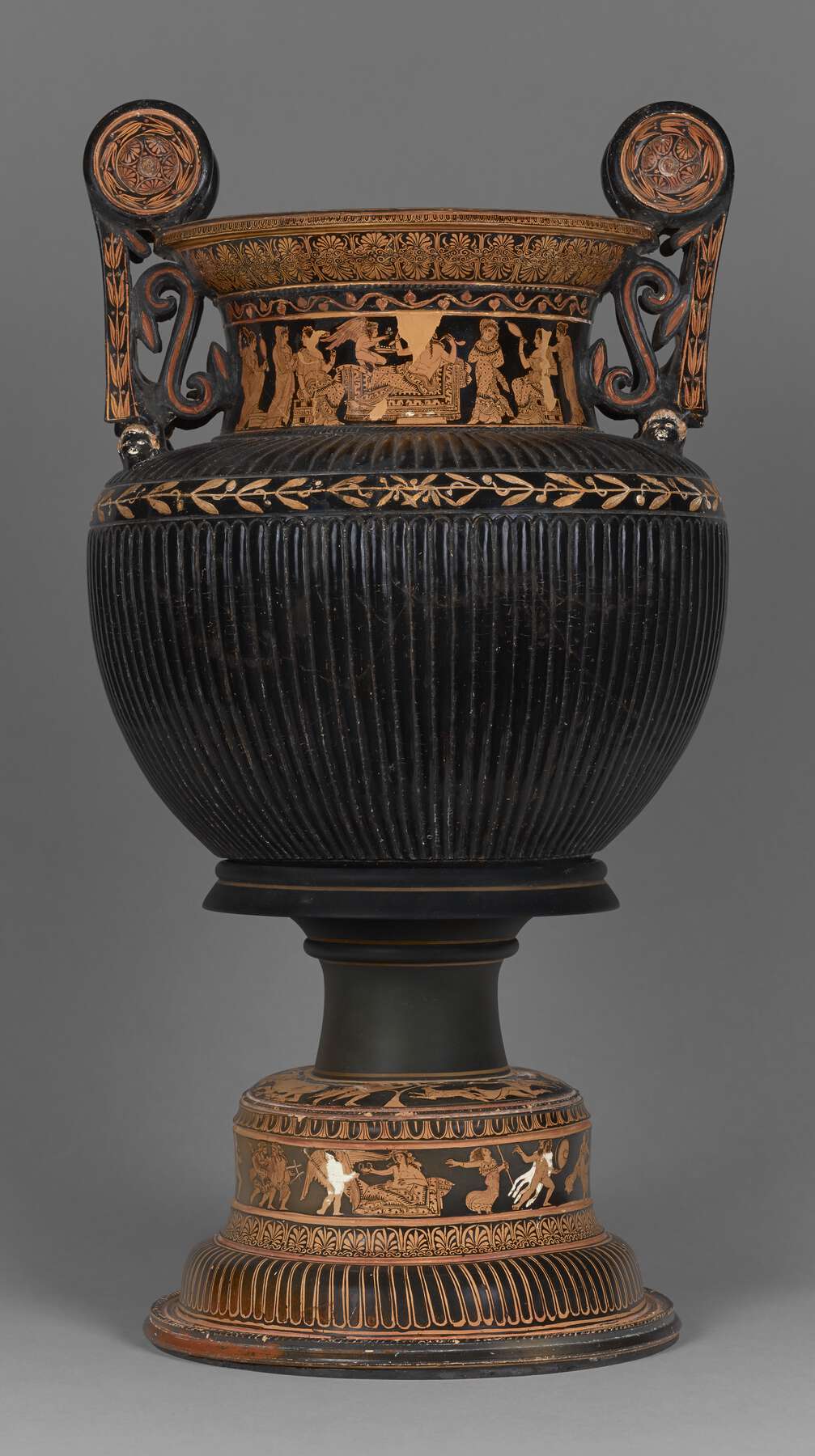 One view of a highly decorated vase with ornate handles