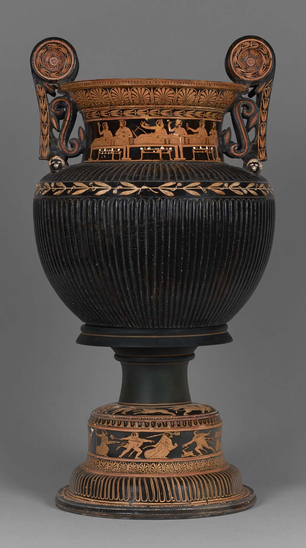 Another view of the highly decorated vase with ornate handles