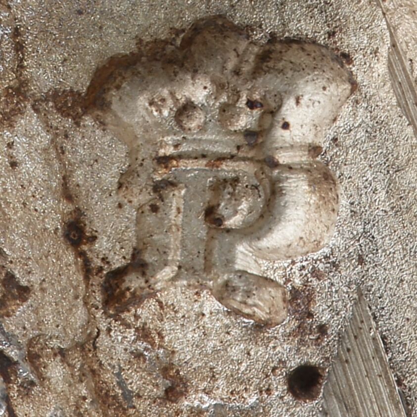 Close-up of a crowned P stamped on the girandole.