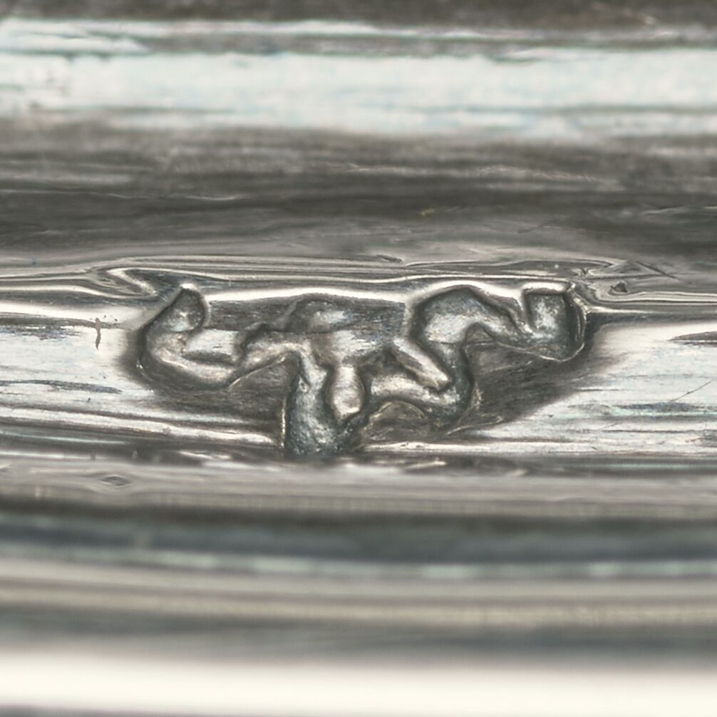 Close-up of a cow partially stamped on the tray.