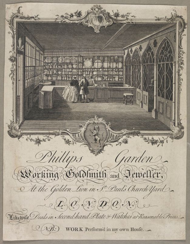 Card with a box featuring a drawing of a silverware shop and the message Phillips Garden Working Goldsmith and Jeweler below the box.