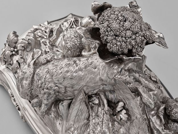 Angled top view of the centerpiece with a life-like rabbit and detailed cauliflower.