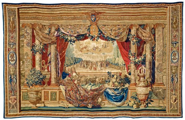 Gold-themed tapestry depicting an opera scene from afar, detailing a terrace framed by three columns on each side, gold curtains, and lush flower garlands with red, green, blue, and yellow details.