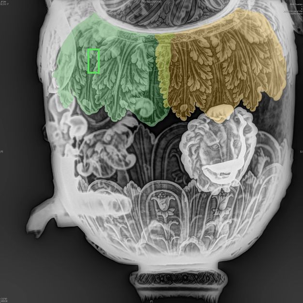 X-radiograph of a fountain's main body with four leaves highlighted green, four highlighted orange, and a neon green rectangle drawing attention to two stamps.
