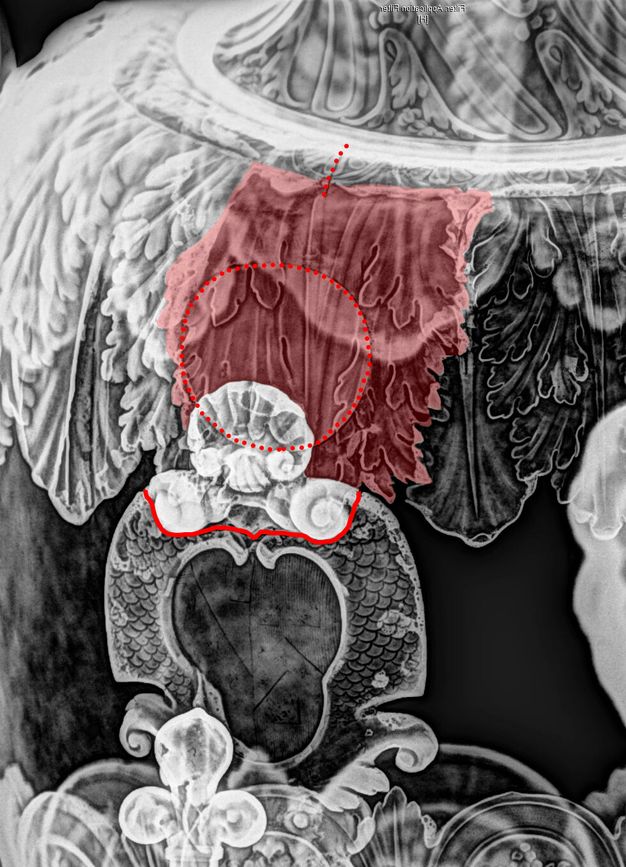 Close-up of an x-radiograph of a fountain, highlighting two leaves in red, delineating the separation between a shell and the central design with a red bracket, and circling the center of the leaves with a dotted red line.