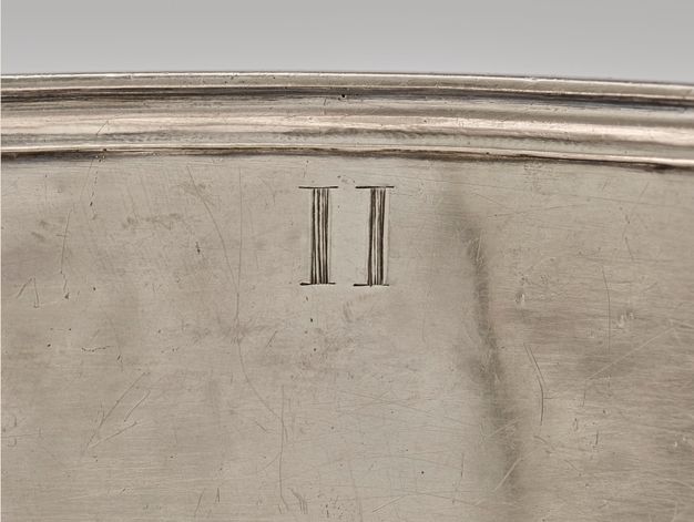 Close-up of the Roman numeral II on the interior of the liner.