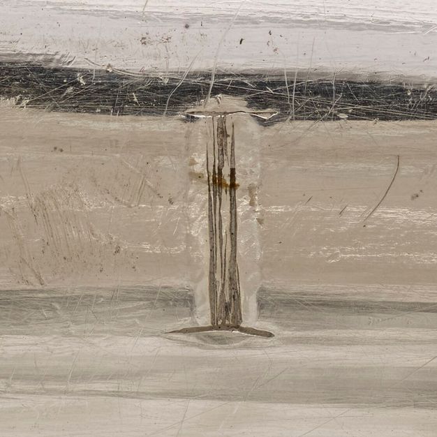 Close-up of the interior rim of the tureen inscribed with the Roman numeral I.