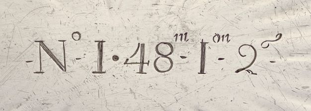 Close-up of the interior bottom of the tureen inscribed with the numeral and weight N° I . 48m - Ion - 2g.