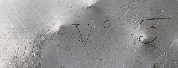 Close-up of the inscription DU N° 3 scratched on the liner.