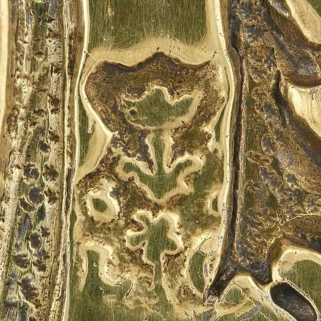 Close-up of a stamped symbol on the bowl's handle.