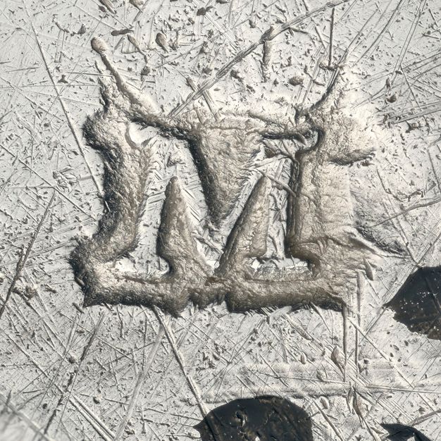 Close-up of a M with serifs stamped on the liner.