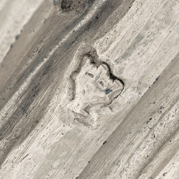 Close-up of a crowned Y stamped on the vessel.